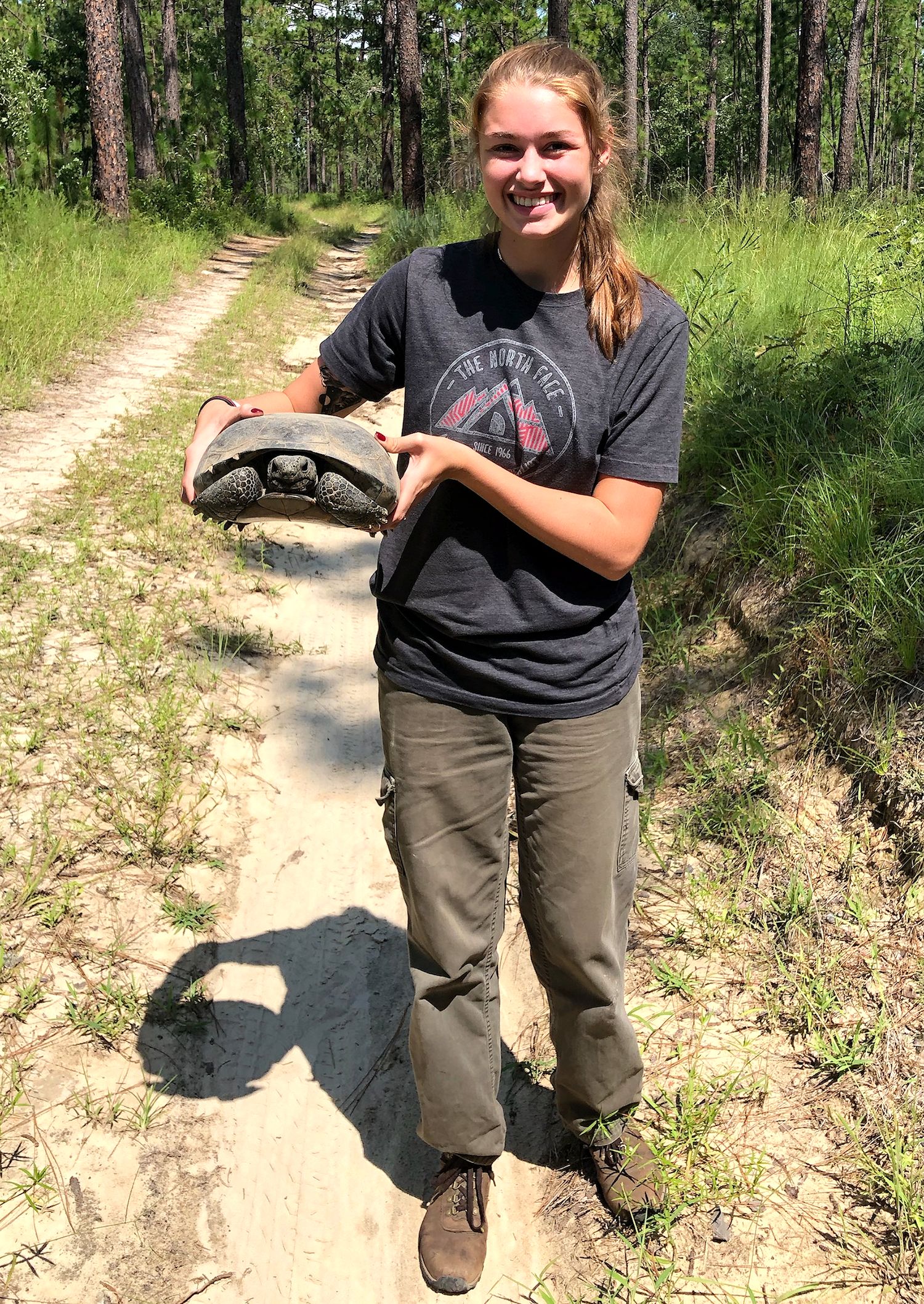 Heidi Miller, daughter of Dr Darren Miller, vice president of forestry programs at the National Council for Air and Stream Improvement Inc. (NCASI), with a gopher tortoise. Photo credit: Darren Miller